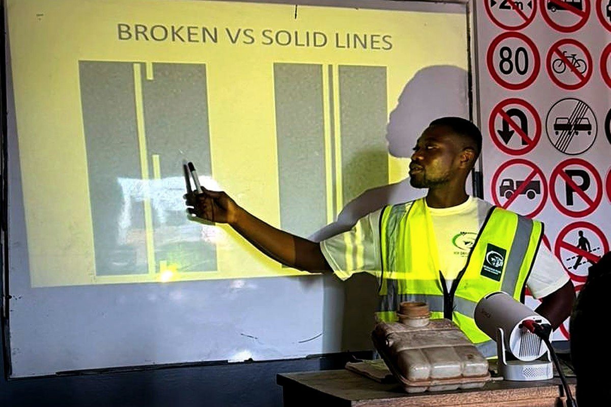 Instructor explaining broken and solid road lines to students