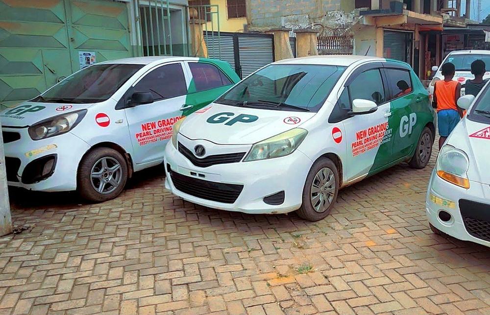 Academy training cars parked outside the school